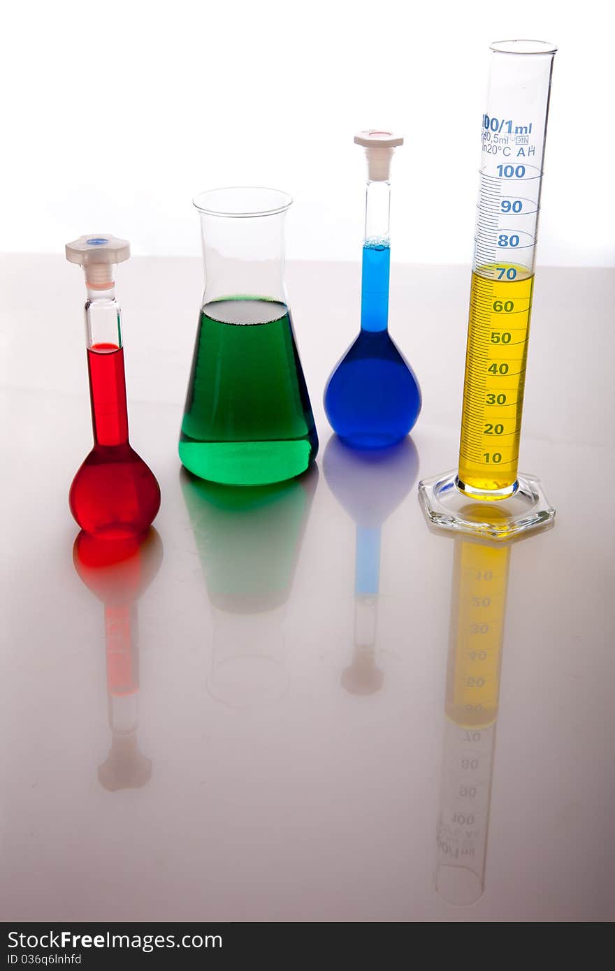 Labolatory glassware with colorful fluids isolated