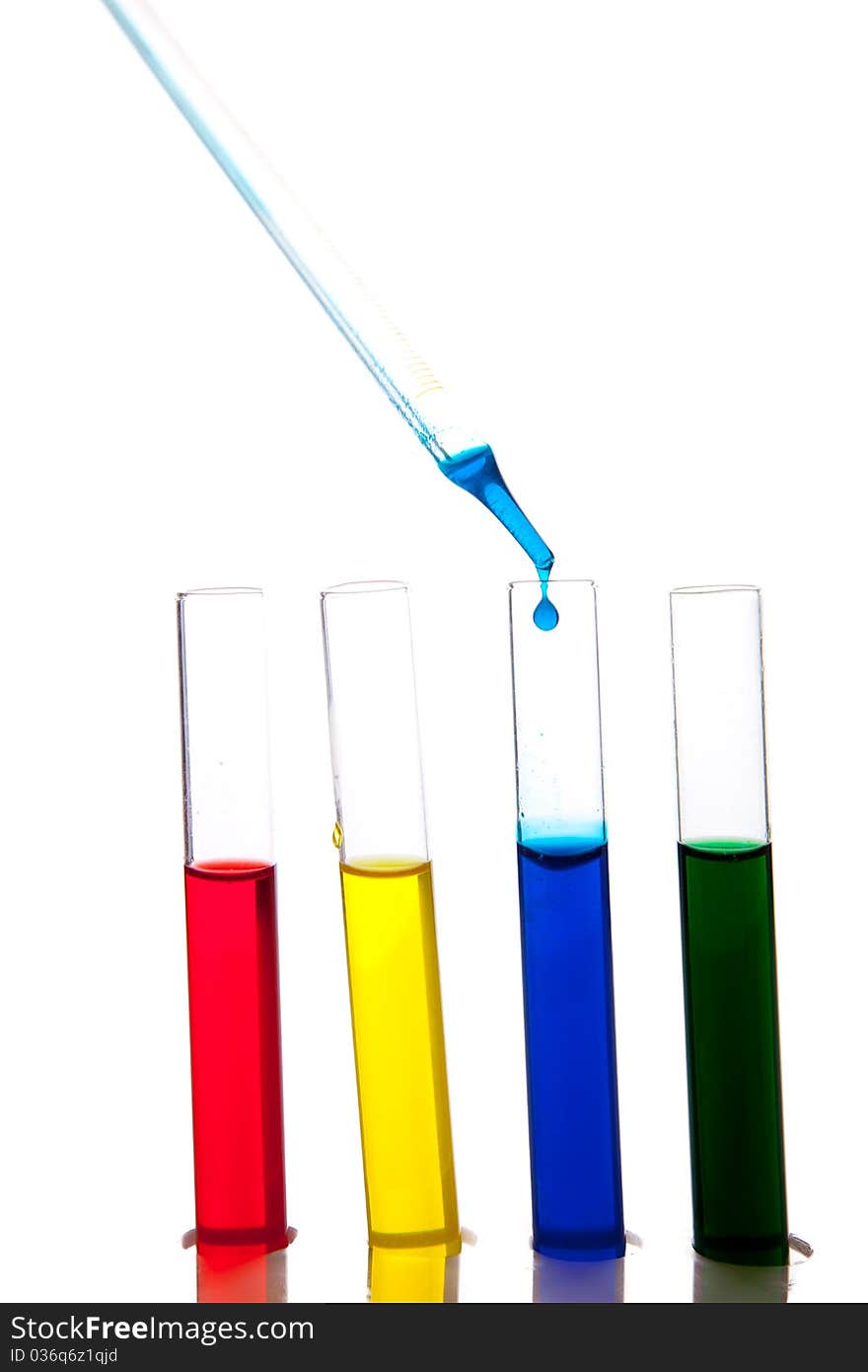 Labolatory glassware with colorful fluids isolated