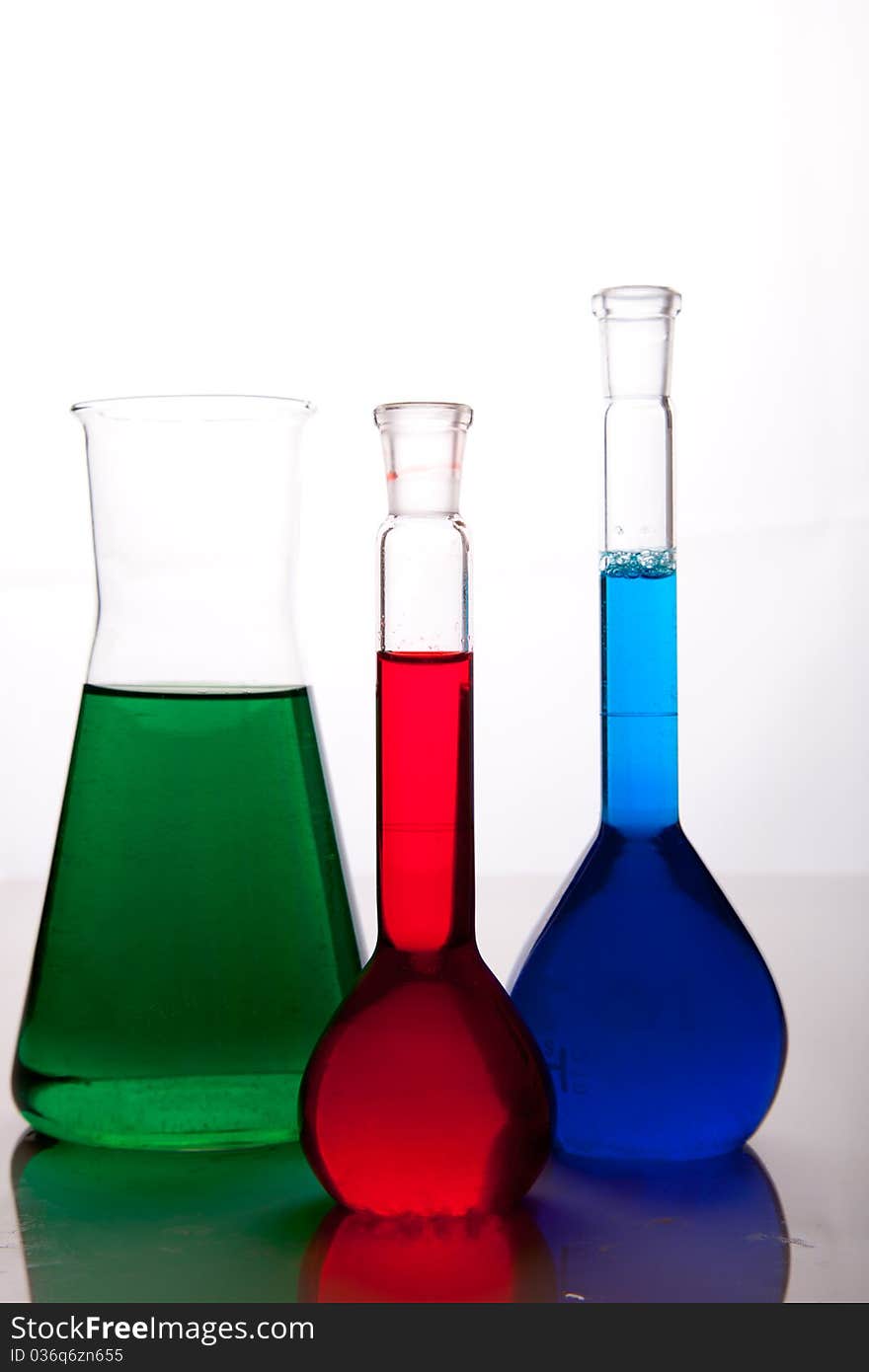 Labolatory glassware with colorful fluids isolated