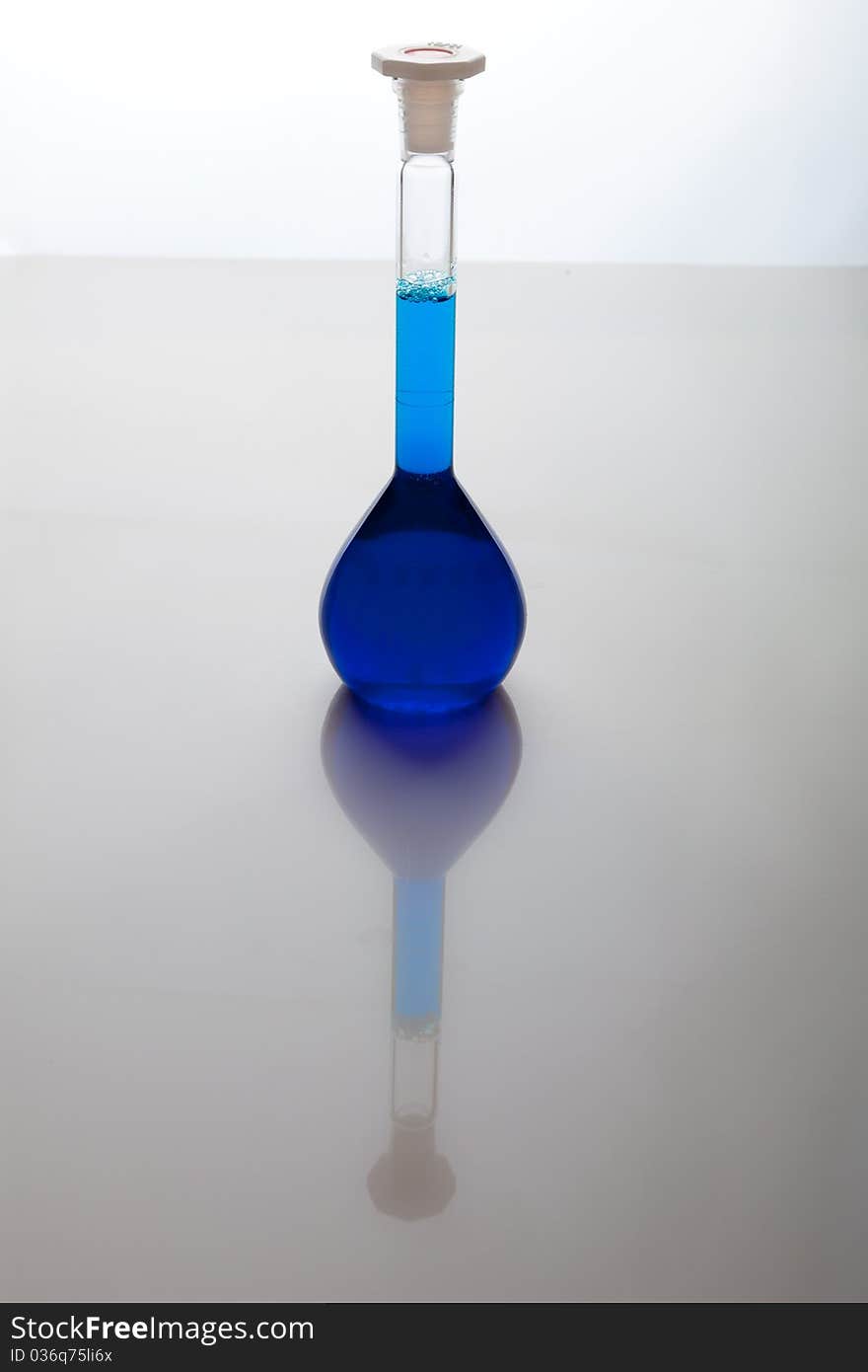 Labolatory glassware with colorful fluids isolated