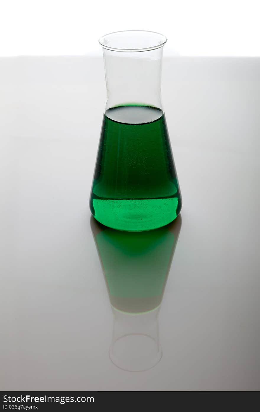 Labolatory glassware with colorful fluids isolated