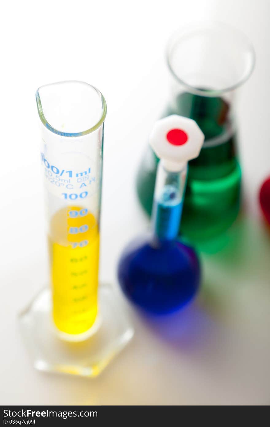 Labolatory glassware with colorful fluids isolated