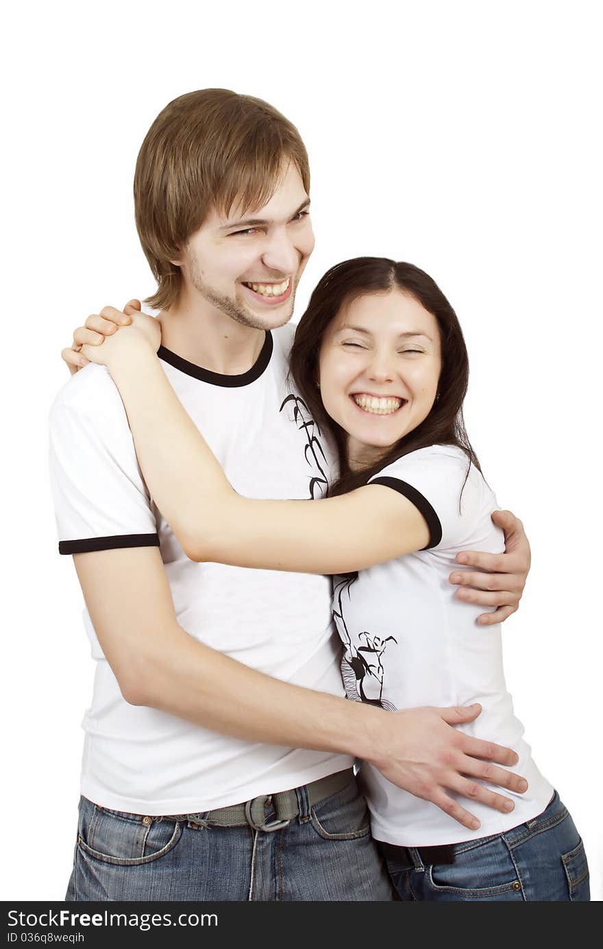 Beautiful young couple laughing and hugging. Beautiful young couple laughing and hugging