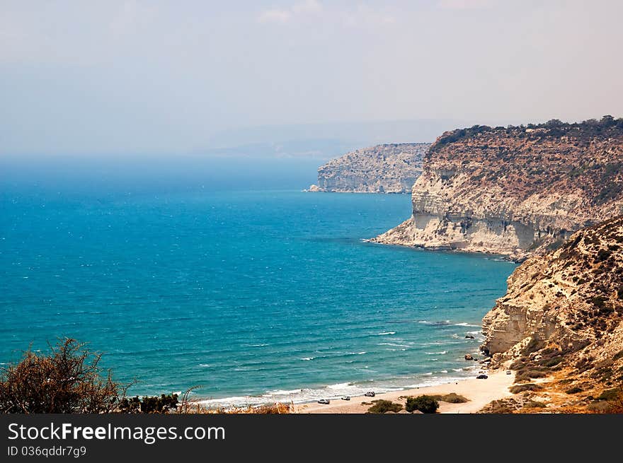 Kourion coast with blue sea and sky with clouds