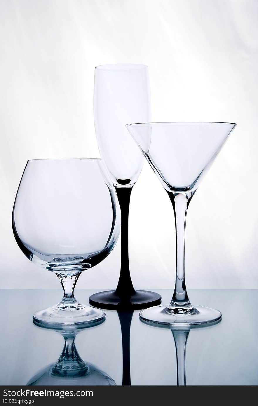 Three glasses of wine with highlights on the table