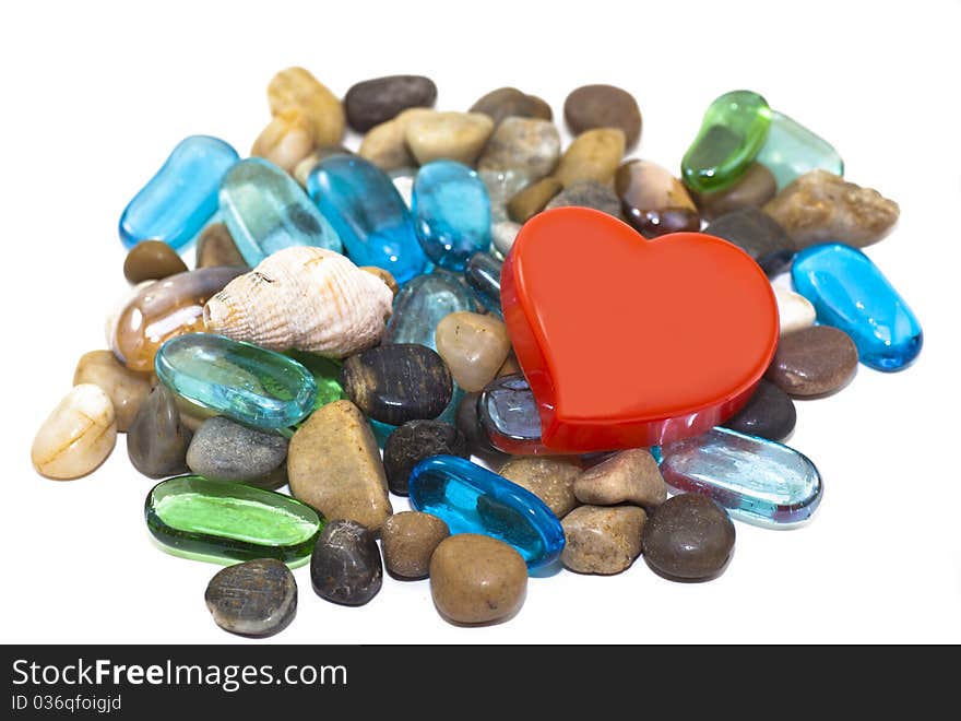 Red hart and colorful gemstones. Red hart and colorful gemstones.