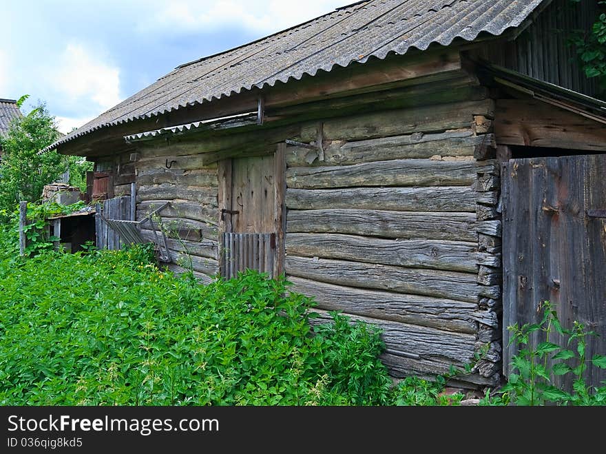 Old abandoned barn for cattle in summer. Old abandoned barn for cattle in summer