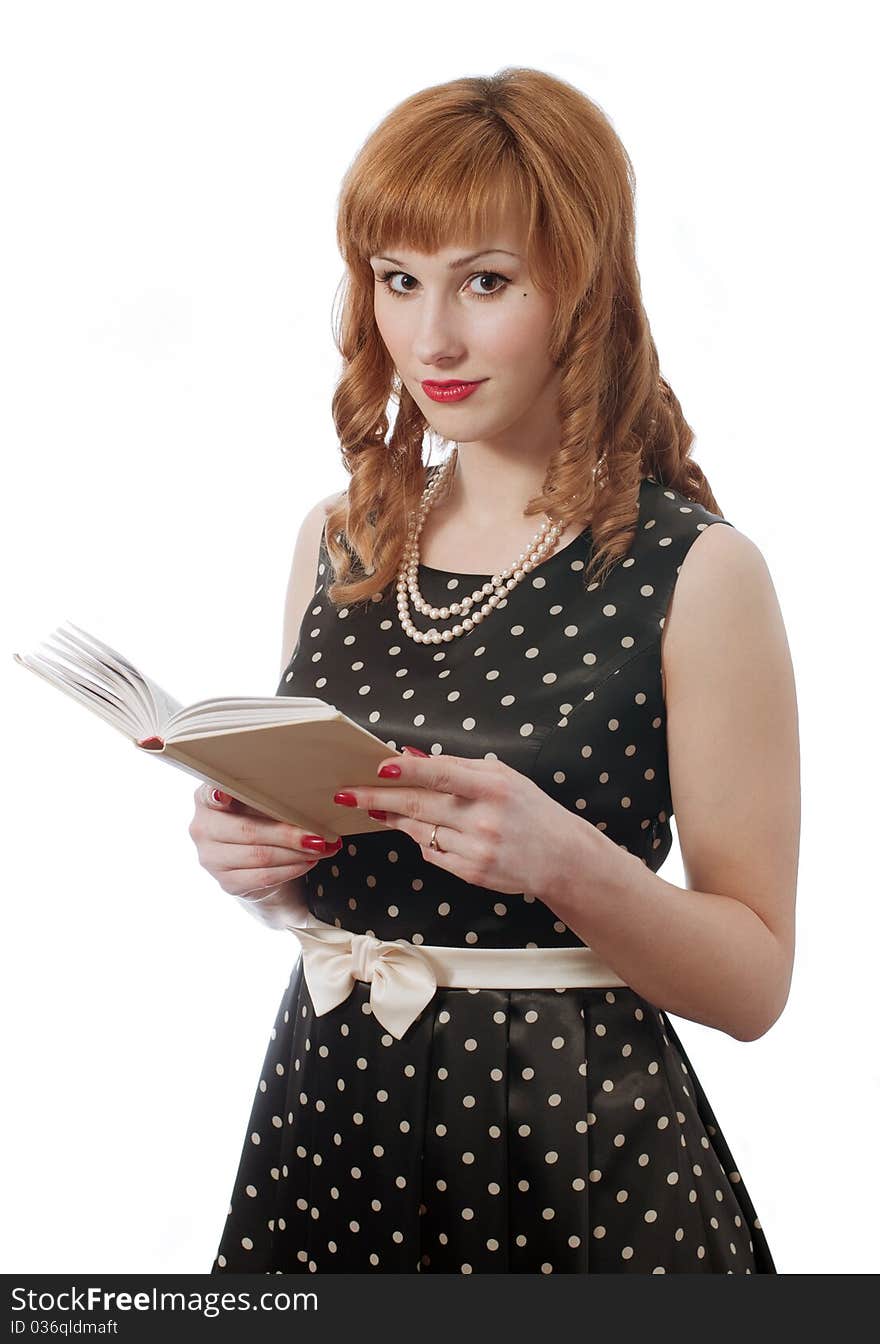 Retro girl in polka dot dress with the book in the hands. Retro girl in polka dot dress with the book in the hands