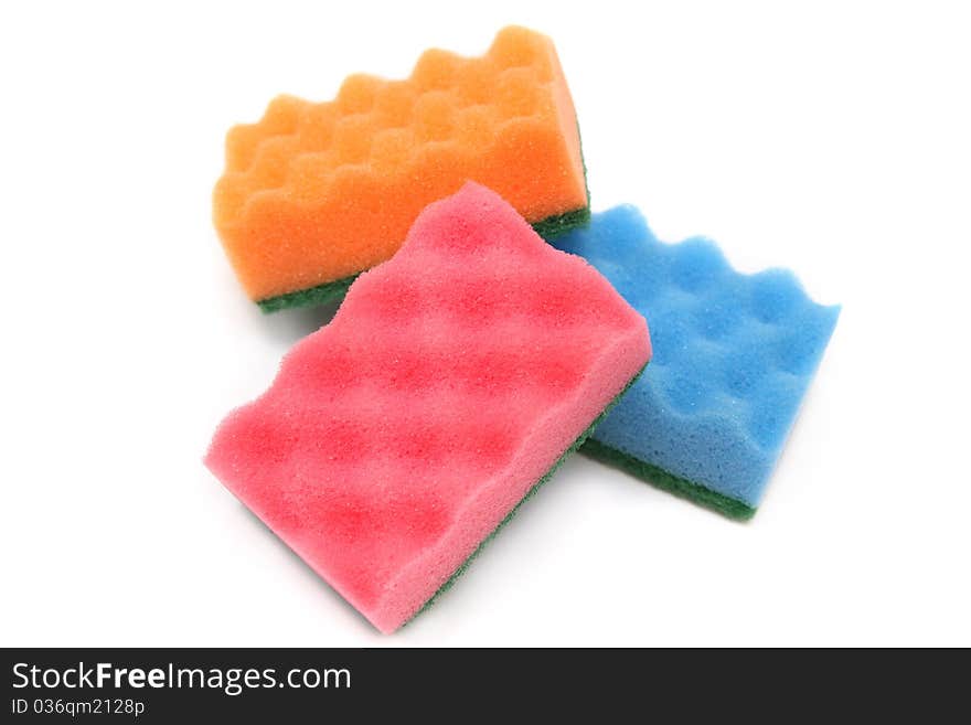 Three colorful sponges fore house cleaning - isolated. Three colorful sponges fore house cleaning - isolated