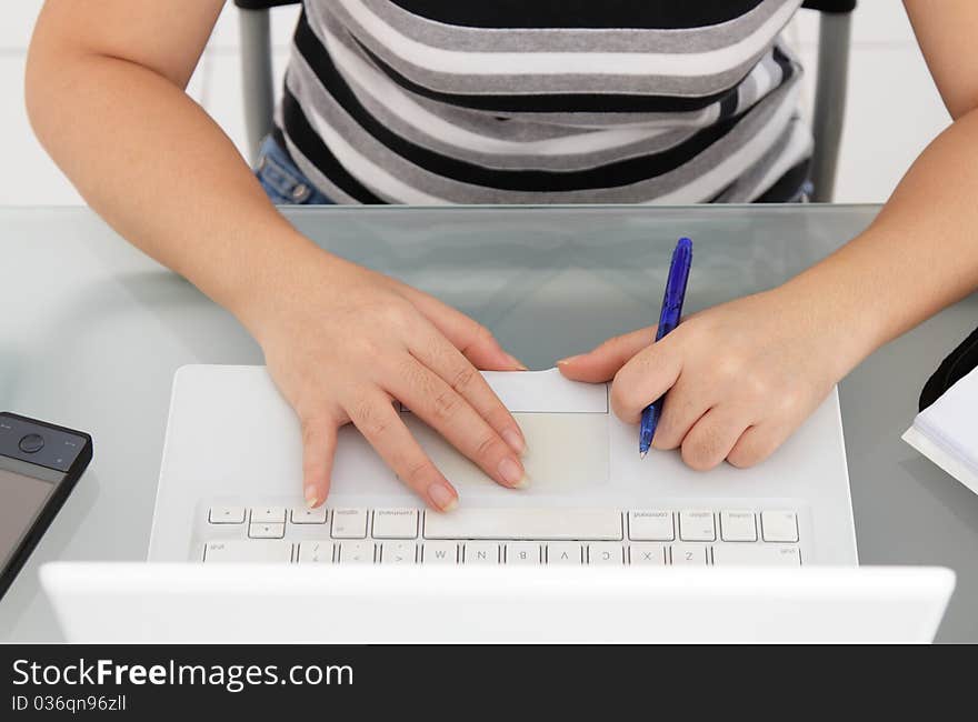 Close-up of a woman's arms on a laptop. Close-up of a woman's arms on a laptop