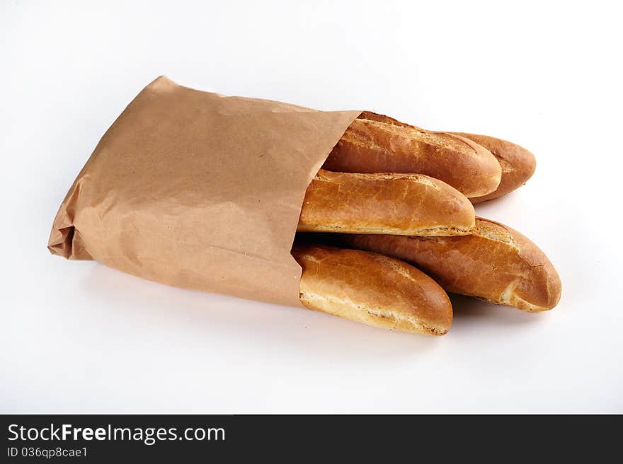 Loaf of white bread, packaged in a paper bag on white background. Loaf of white bread, packaged in a paper bag on white background