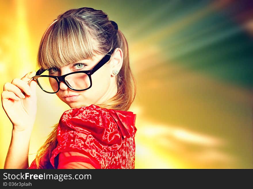 Cute young girl in red dress at abstract light background. Cute young girl in red dress at abstract light background