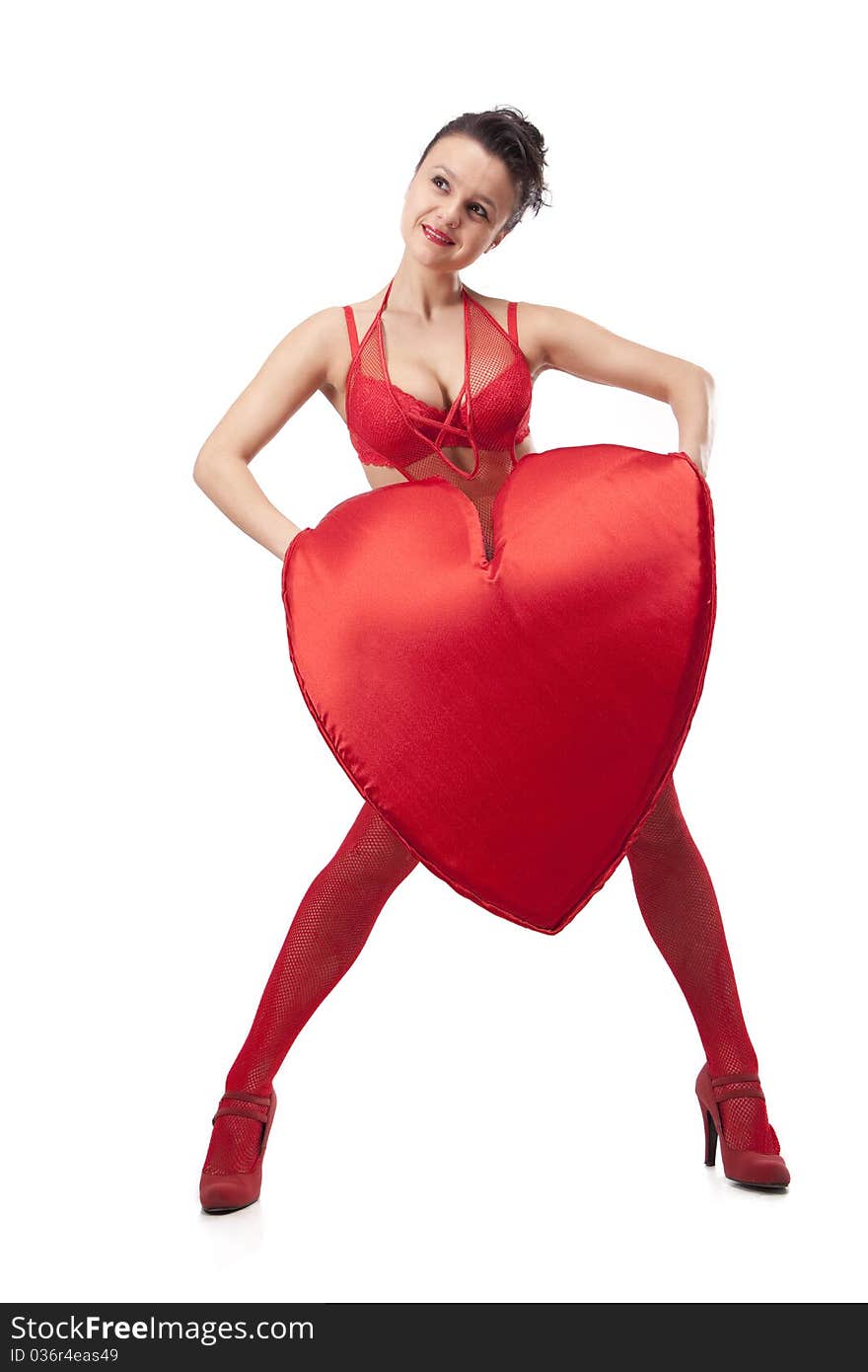 Young woman in red lingerie holding big Heart over white. Young woman in red lingerie holding big Heart over white