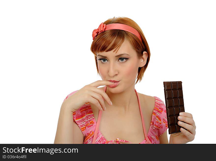 Beautiful woman eating chocolate bar.isolated