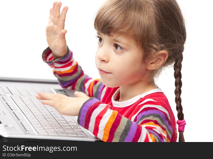 Portrait of a little girl with a laptop