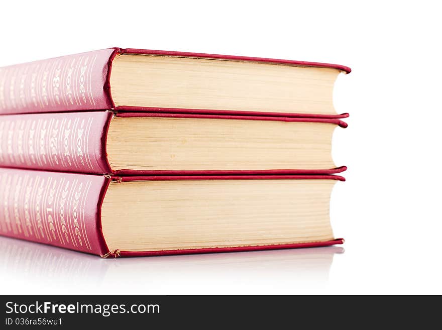 Old red books on white background. Isolated.