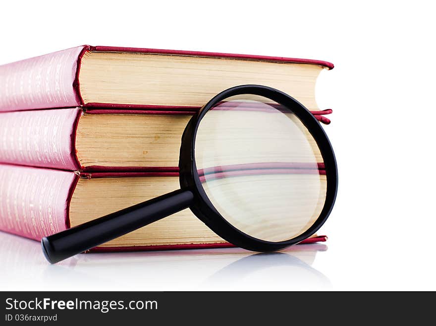 Old Books With A Loupe On White Background.