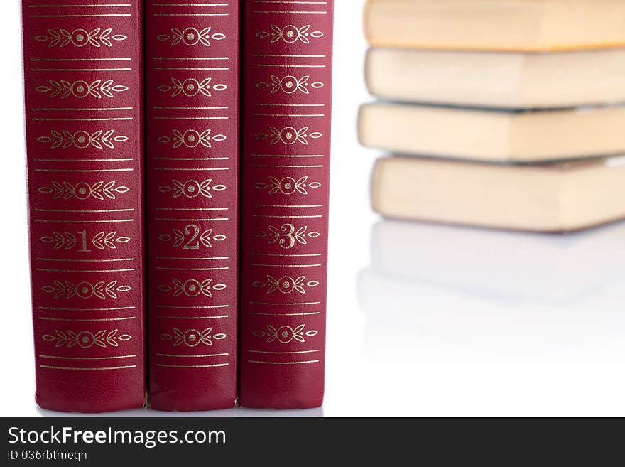 Old red books on white background. Isolated.