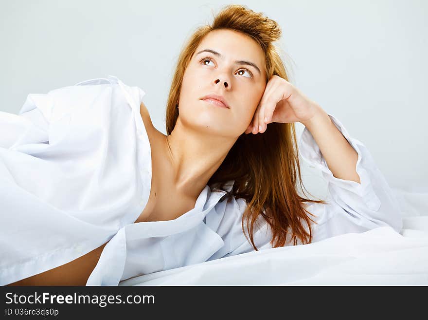 Young woman in a white men s shirt