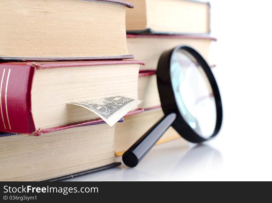 Old Books With A Loupe On White Background.