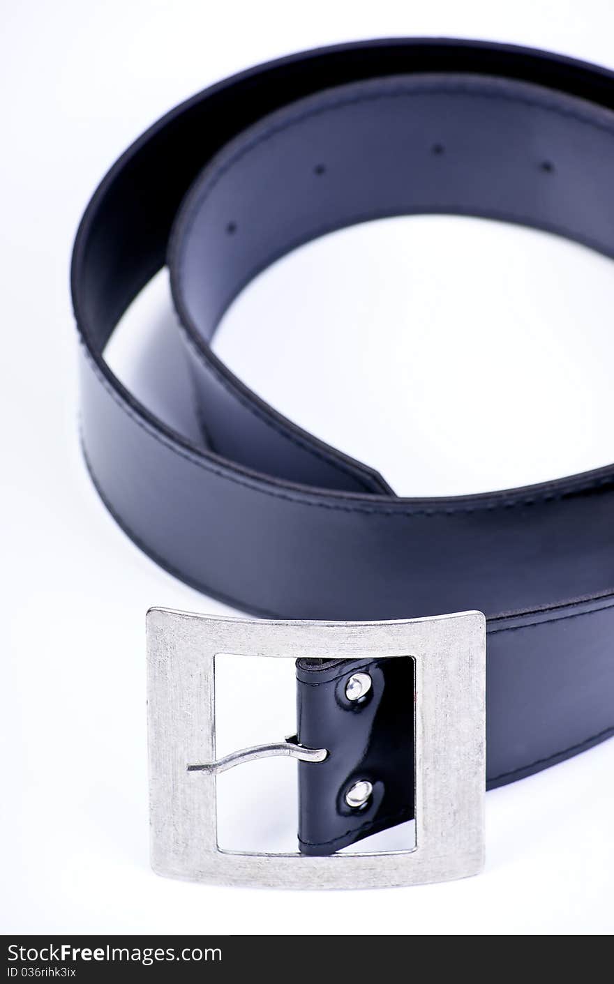 Belt strap and buckle wrapped up on a white background