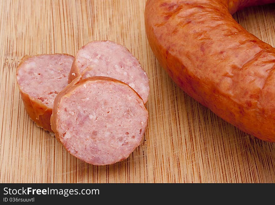 Fatty home smoked sausage on the kitchen blackboard.