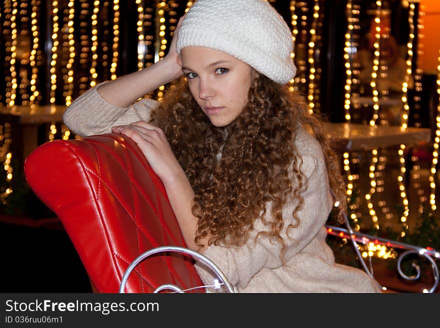 Pretty teenage girl in beret  with fire-lights