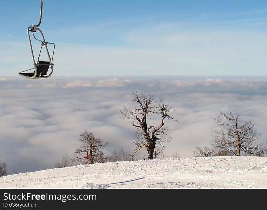 Ski lift above the clouds