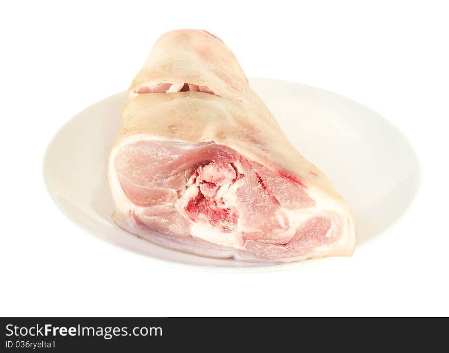 Crude pork on a white plate