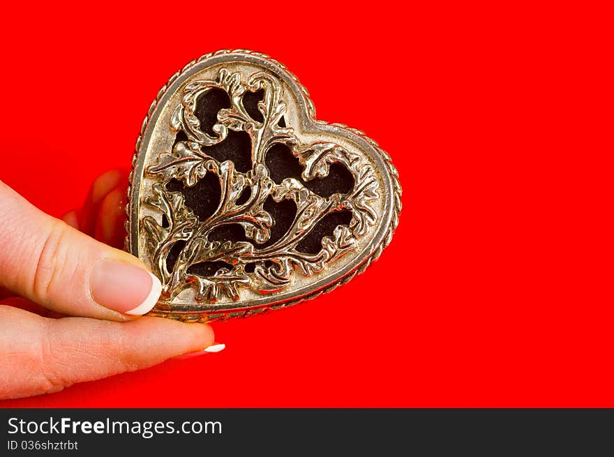 Bronse antique heart in hand