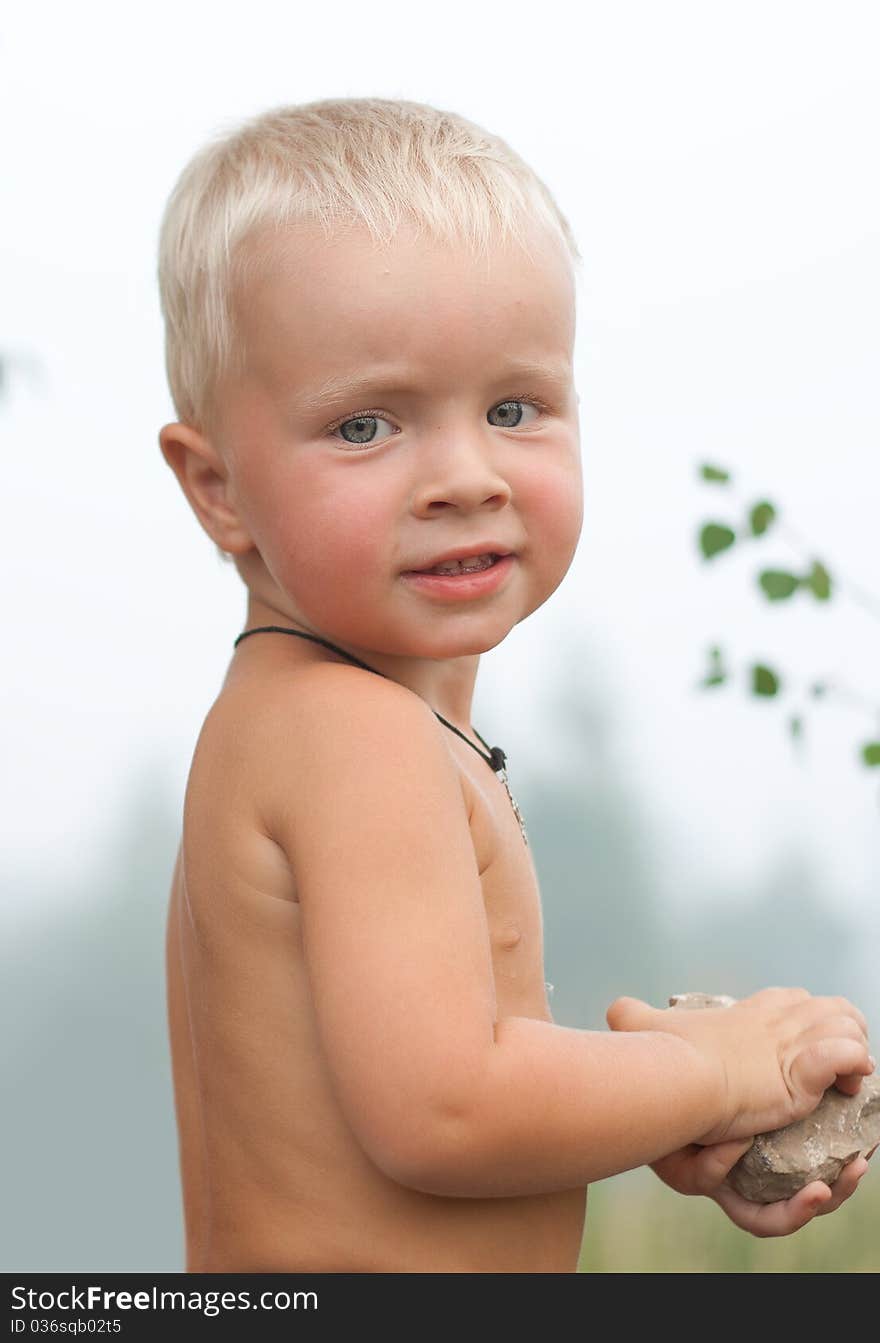 Portrait of young adorable boy against forest. Portrait of young adorable boy against forest