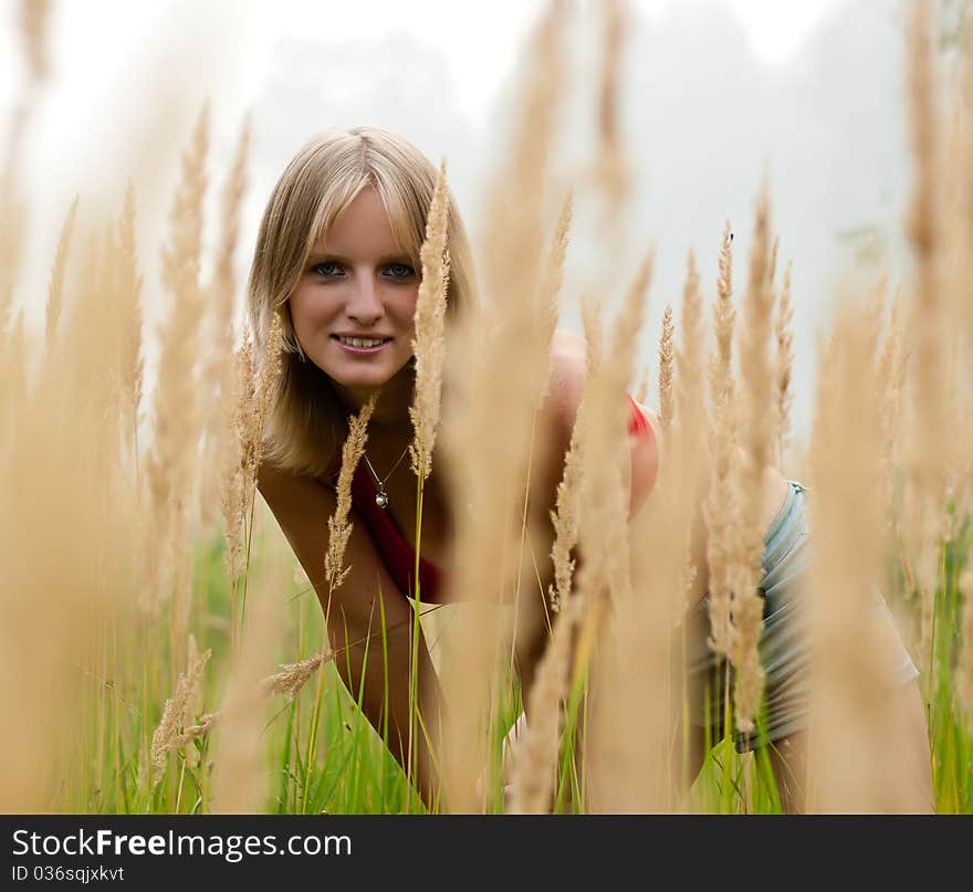 In The Field young lady smile. fog