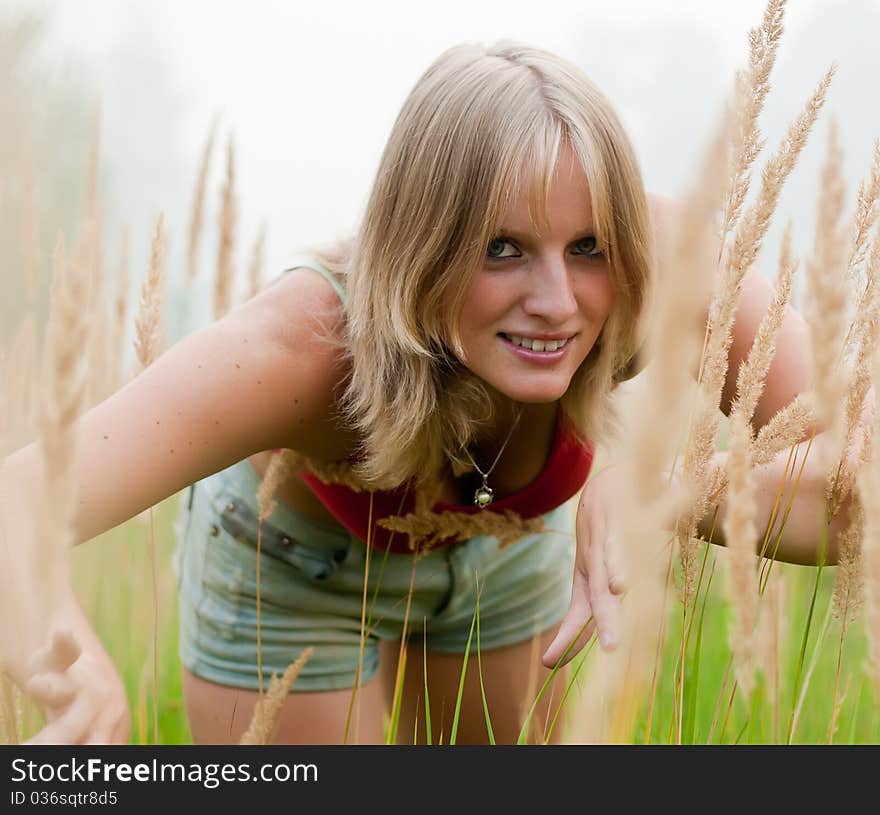 In The Field young lady smile. fog