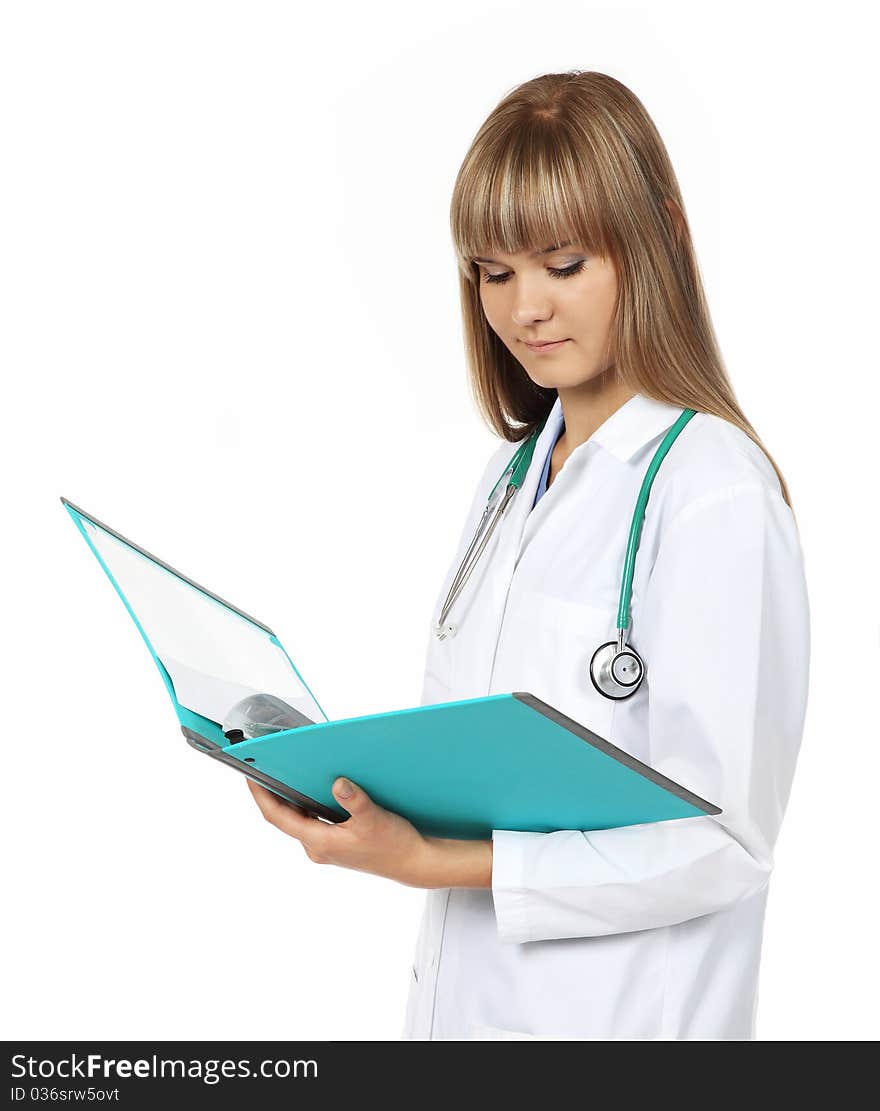 Pretty young female doctor holds a colorful folder. Pretty young female doctor holds a colorful folder