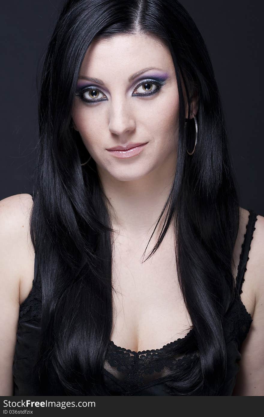 Brunette woman with blue and purple makeup