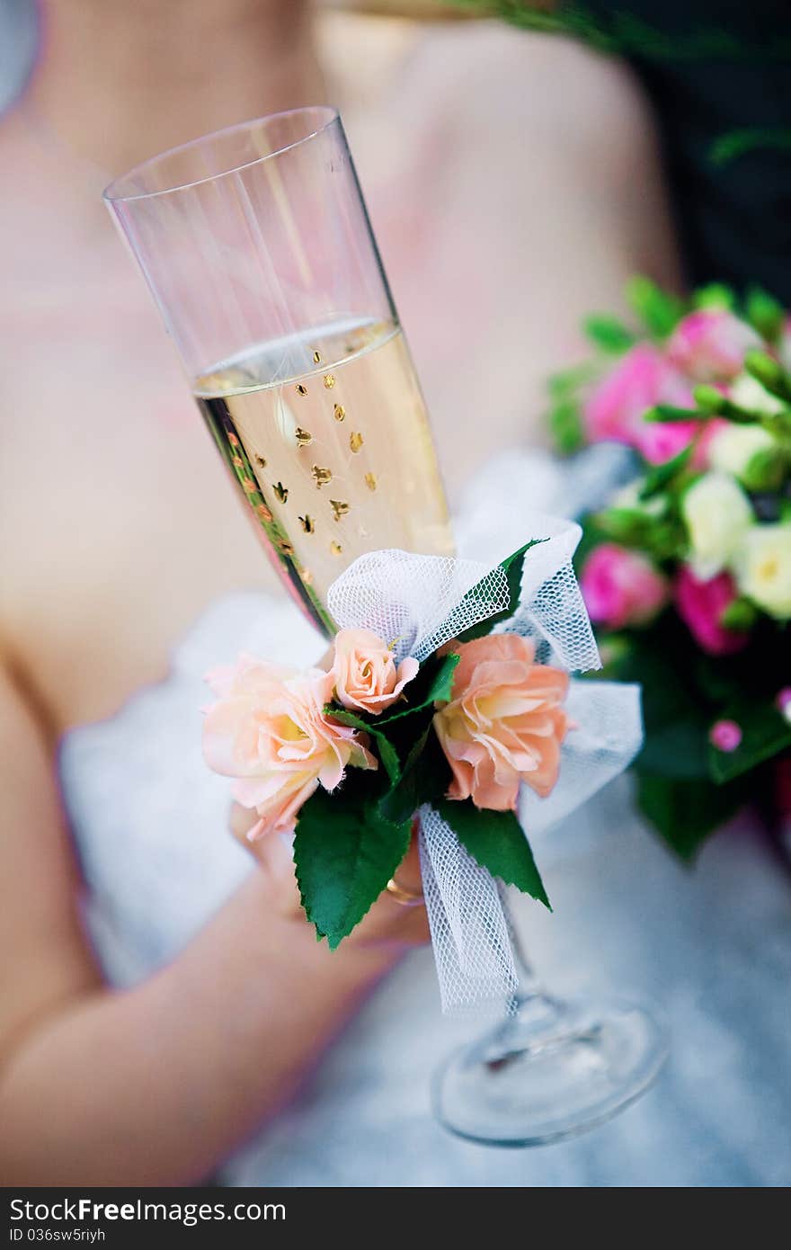 Bride with a glass and a bouquet