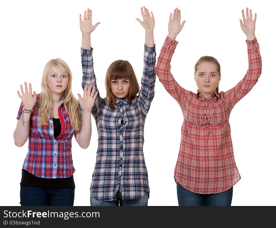 Three friends raised their hands up on a white background