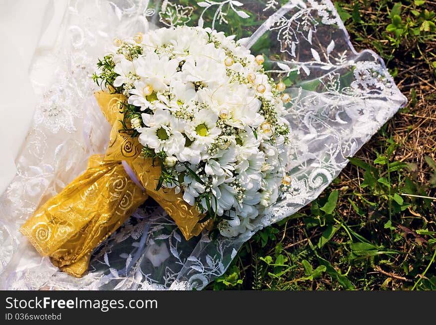 Bridal bouquet on dress, Bouquet of chamomiles