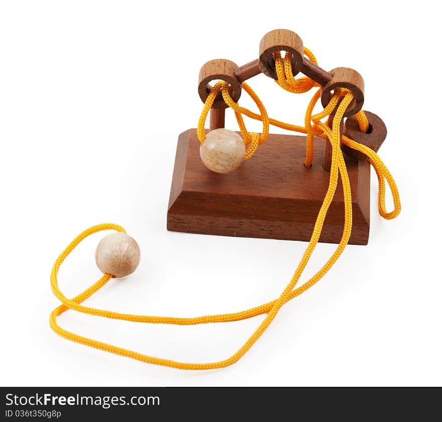 Wooden puzzle with a yellow rope and balls