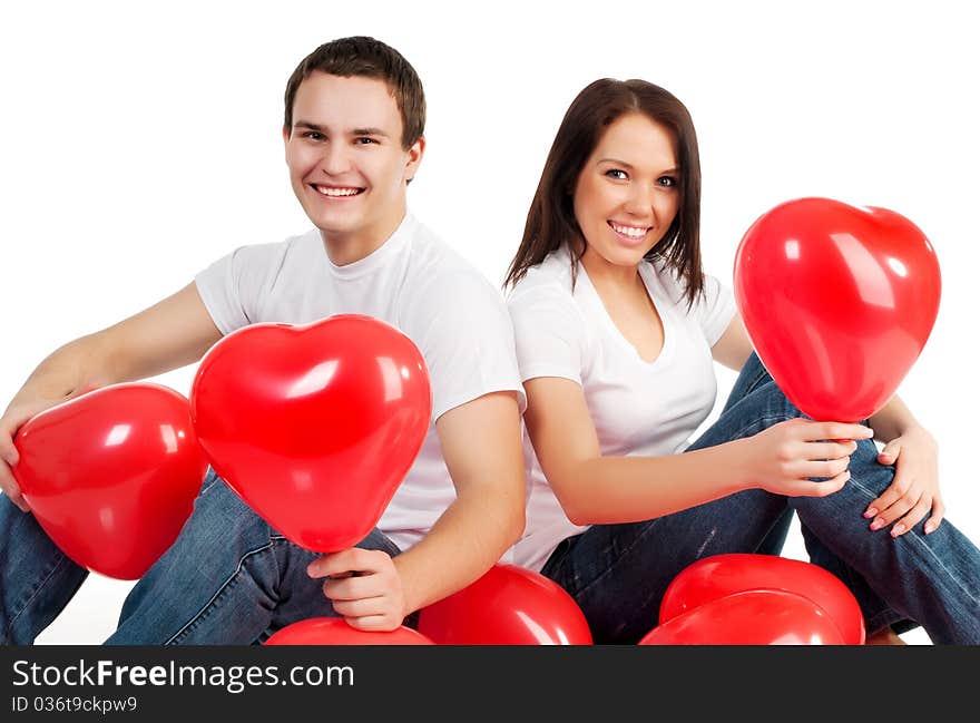 Couple with a red heart on white background