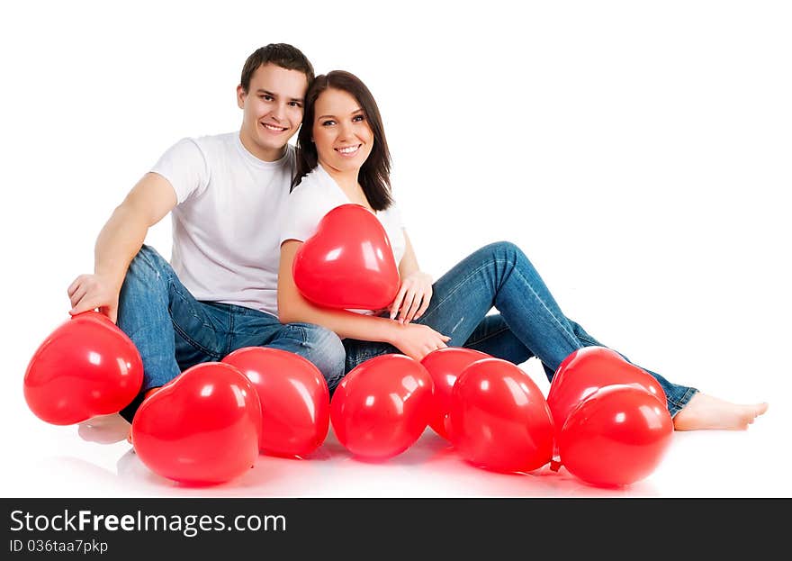 Couple with a red heart on white background