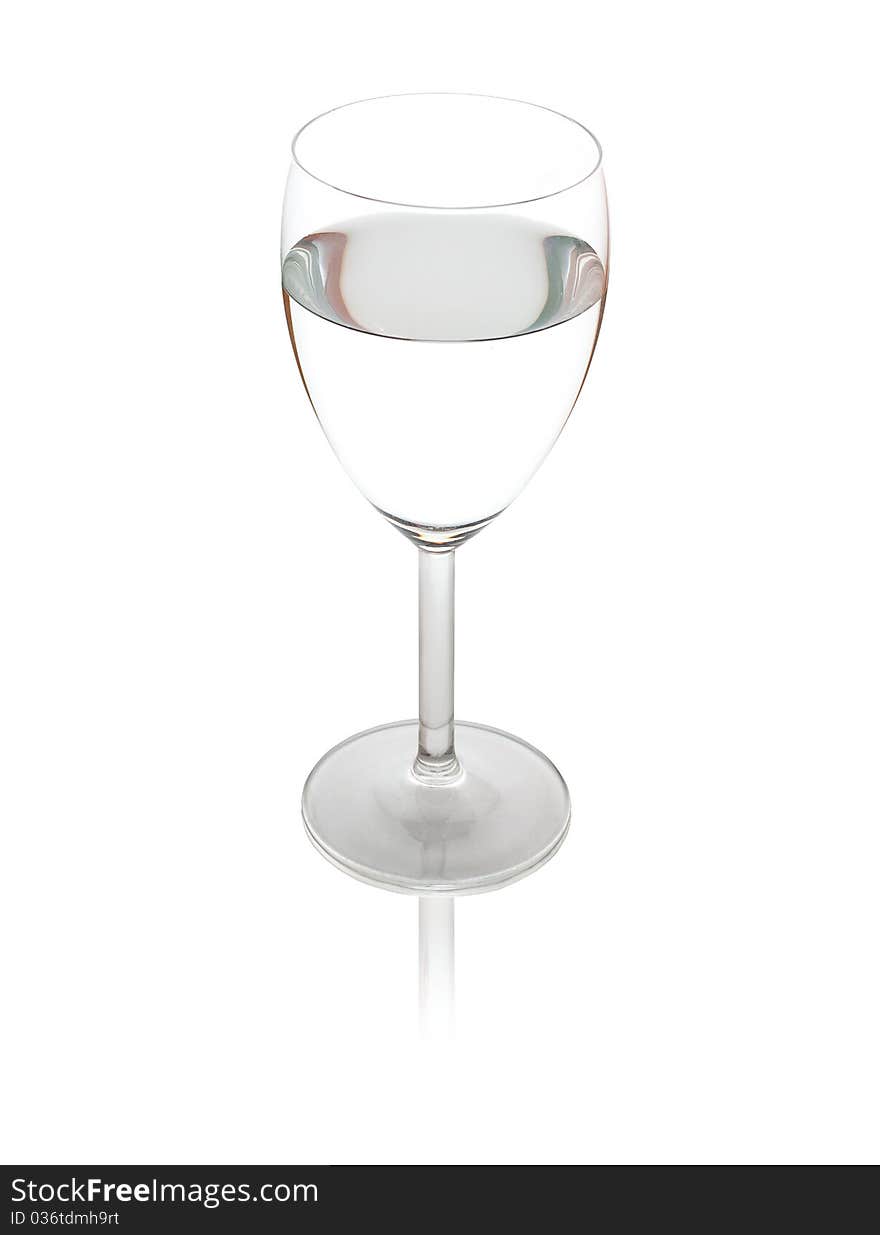 Water in a wineglasse on a wite background. Water in a wineglasse on a wite background.