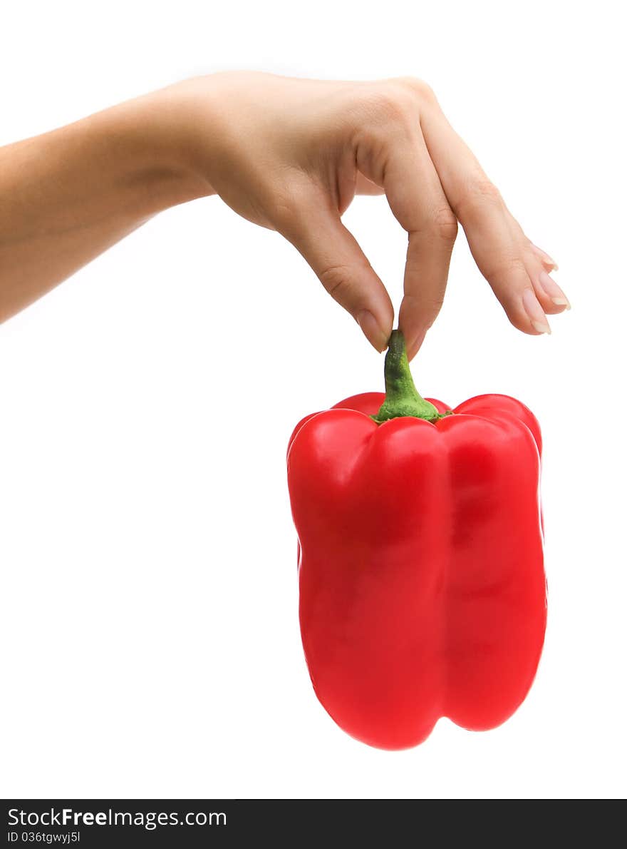 Woman s hand holding paprika.