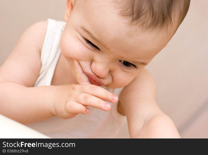 Fun caucasian baby with finger