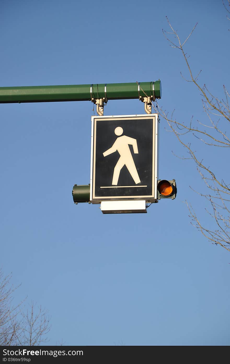 Pedestrian sign with nature view