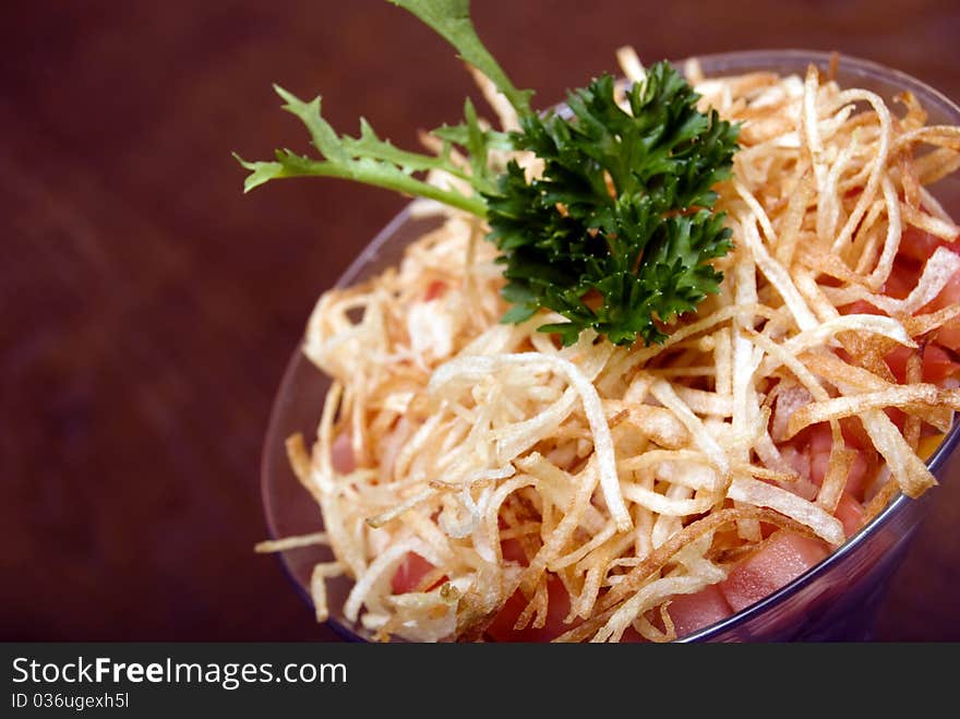 Salad with crunchy potato in glass. Salad with crunchy potato in glass