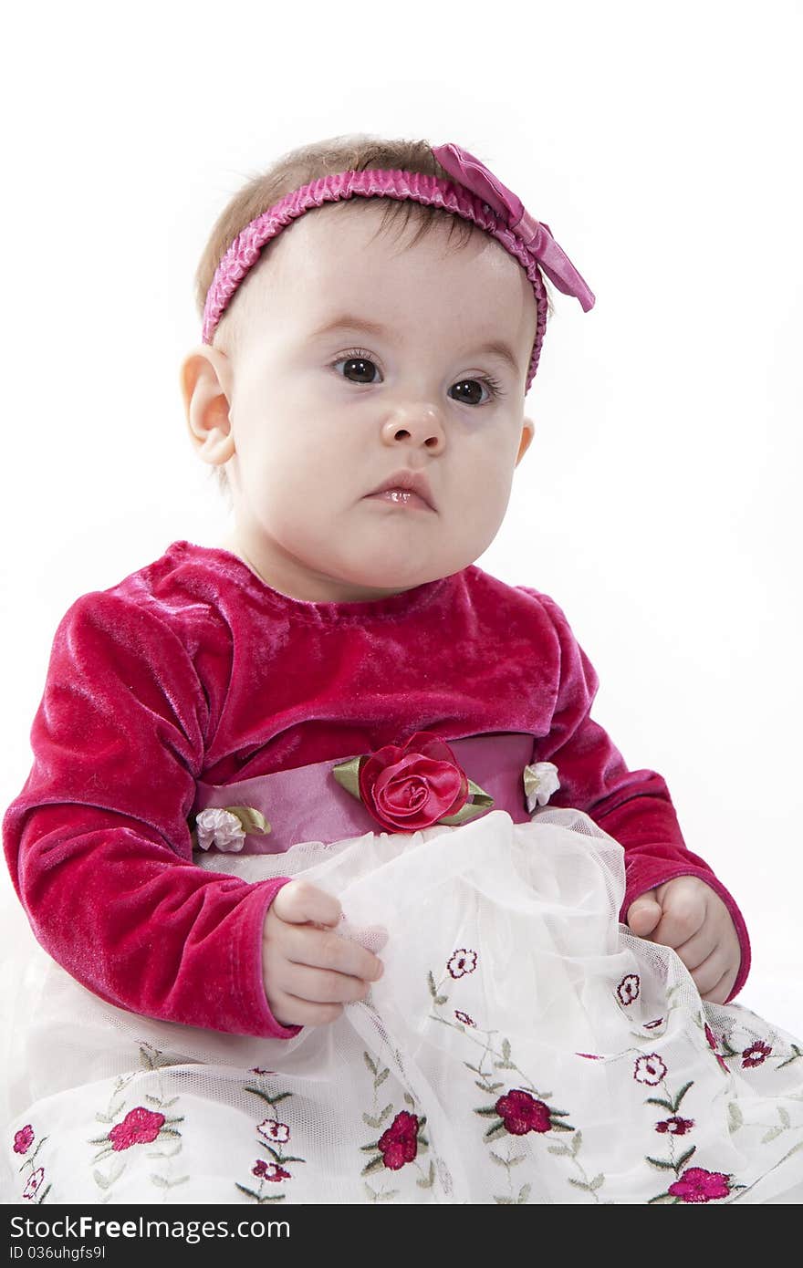 Portrait of sitting little girl isolated on white. Portrait of sitting little girl isolated on white.