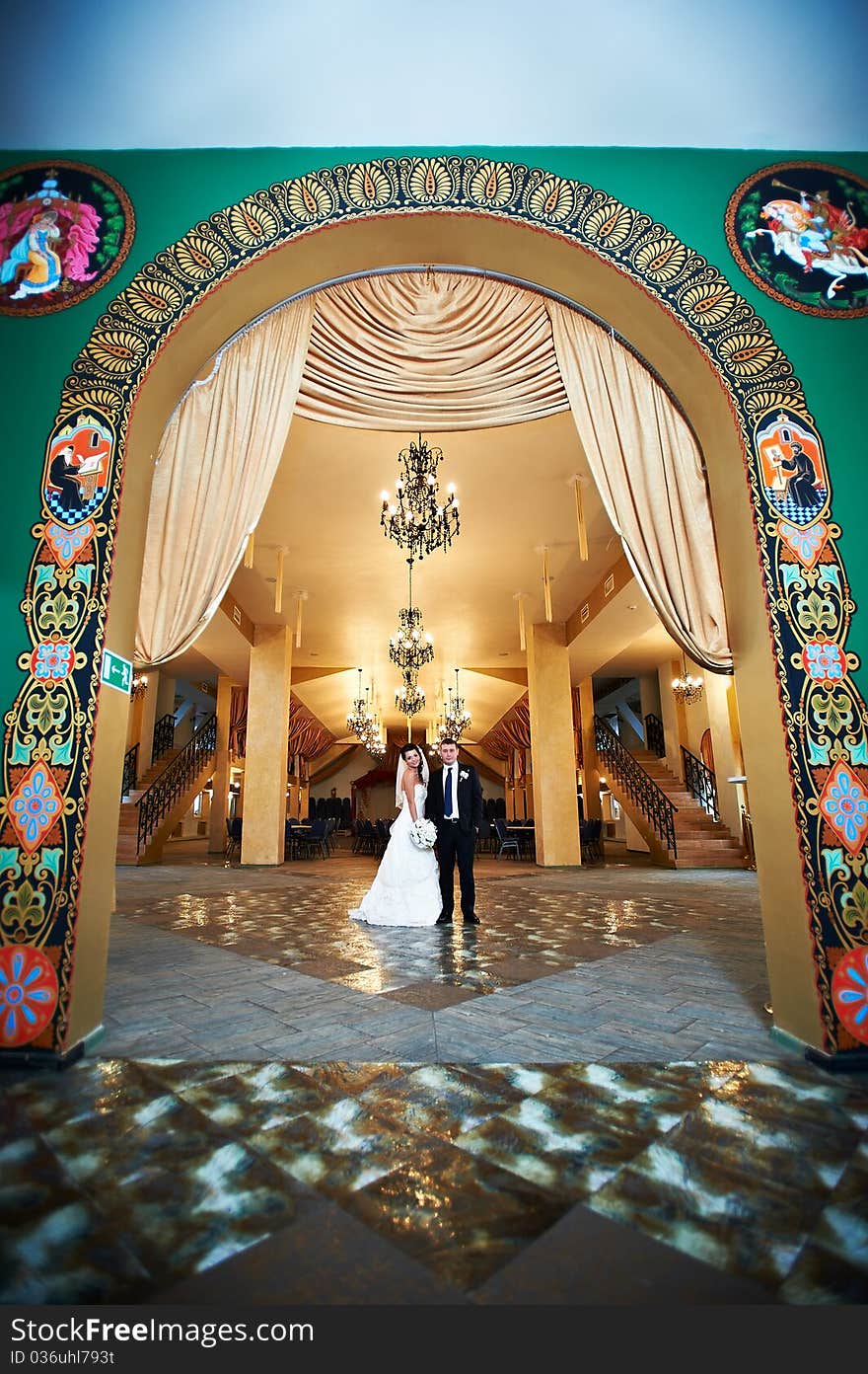 Bride and groom in beautiful interiors of Russian palace