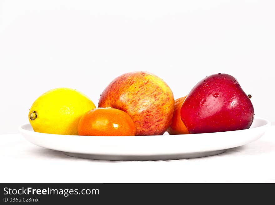 Mixed fruits lying on a plate