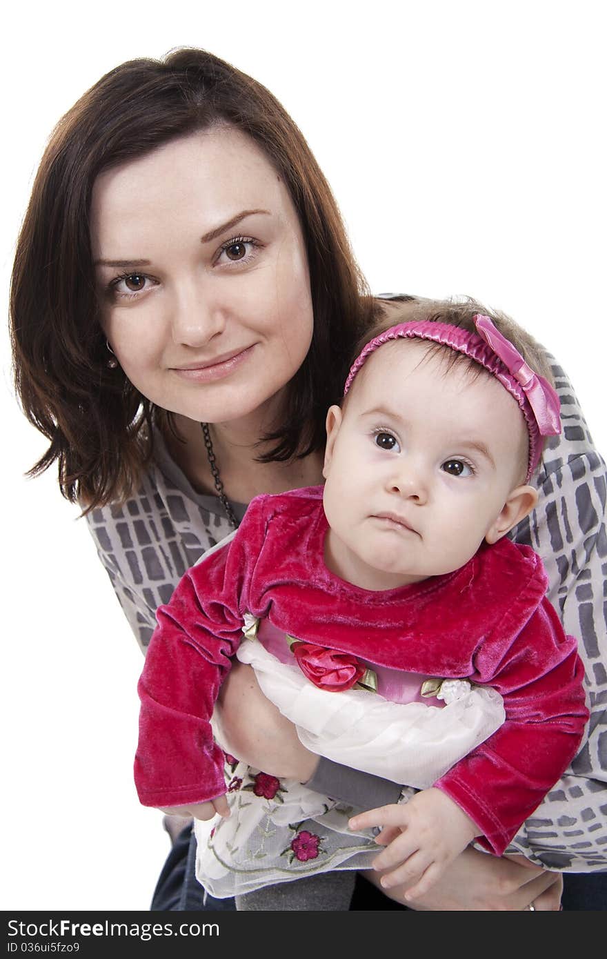 Mother with her sweet little daughter isolated on white. Mother with her sweet little daughter isolated on white.